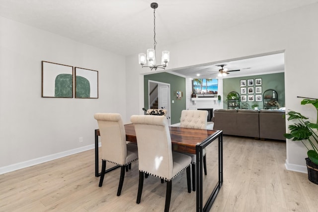 1013 Brightwood Ct, Clarksville, TN 37043 - dining space featuring light wood-style flooring, ceiling fan, a chandelier, and baseboards