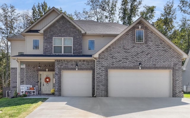 1013 Brightwood Ct, Clarksville, TN 37043 - view of front of house featuring concrete driveway, board and batten siding, and brick siding