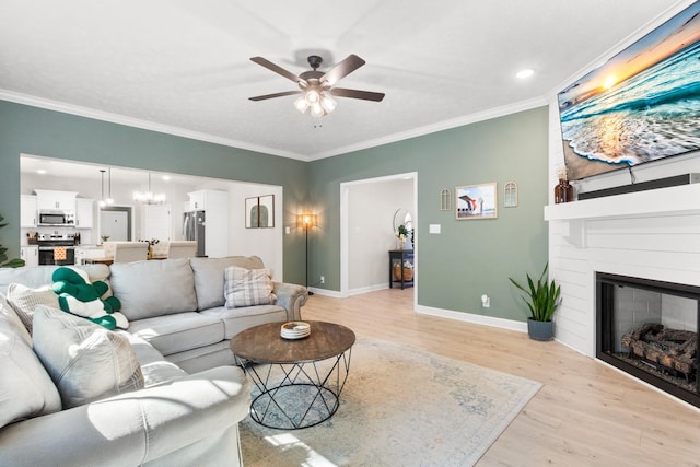 1013 Brightwood Ct, Clarksville, TN 37043 - living area featuring ceiling fan, light wood-style flooring, crown molding, baseboards, and a fireplace