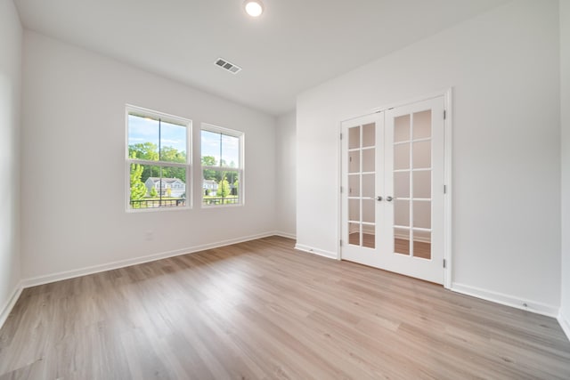 316 Deacon Ln, White House, TN 37188 - spare room featuring french doors, light wood finished floors, and baseboards
