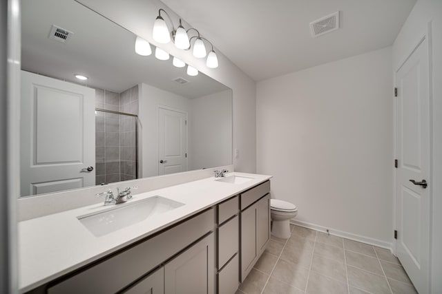 316 Deacon Ln, White House, TN 37188 - bathroom featuring double vanity, baseboards, tiled shower, tile patterned flooring, and toilet