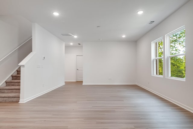 316 Deacon Ln, White House, TN 37188 - spare room featuring light wood-type flooring, recessed lighting, stairs, and baseboards