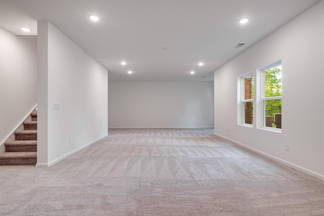 316 Deacon Ln, White House, TN 37188 - unfurnished room featuring light colored carpet, recessed lighting, stairway, and baseboards