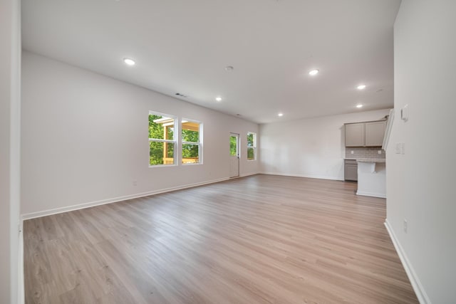 316 Deacon Ln, White House, TN 37188 - unfurnished living room featuring light wood-type flooring, recessed lighting, and baseboards