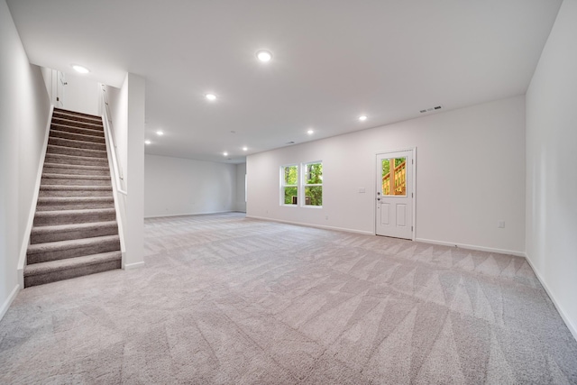 316 Deacon Ln, White House, TN 37188 - spare room with light colored carpet, recessed lighting, stairway, and baseboards