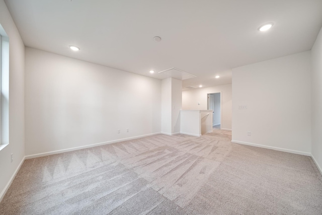 316 Deacon Ln, White House, TN 37188 - spare room featuring attic access, light carpet, recessed lighting, and baseboards