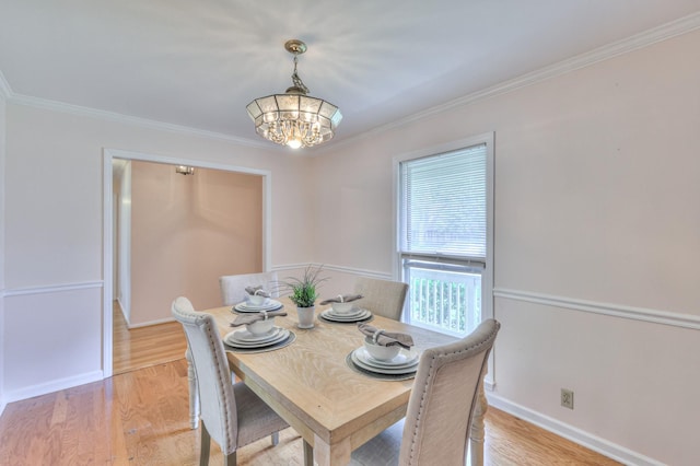 2519 Regency Park Dr, Murfreesboro, TN 37129 - dining room featuring a chandelier, ornamental molding, light wood-type flooring, and baseboards