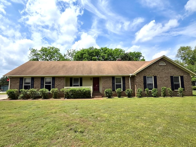 2519 Regency Park Dr, Murfreesboro, TN 37129 - ranch-style home with brick siding, a front yard, a chimney, and a shingled roof