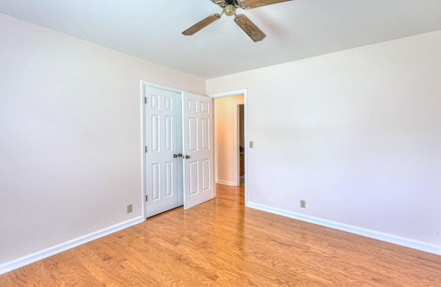 2519 Regency Park Dr, Murfreesboro, TN 37129 - unfurnished bedroom with light wood finished floors, baseboards, a ceiling fan, and a closet