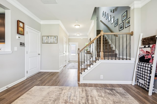 319 Petunia Dr, Smyrna, TN 37167 - entrance foyer featuring wood finished floors, ornamental molding, stairs, and baseboards