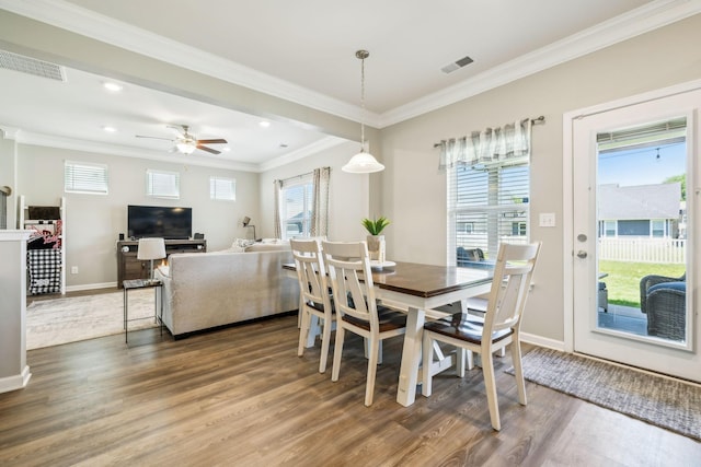 319 Petunia Dr, Smyrna, TN 37167 - dining area featuring wood finished floors, baseboards, healthy amount of natural light, ornamental molding, and recessed lighting