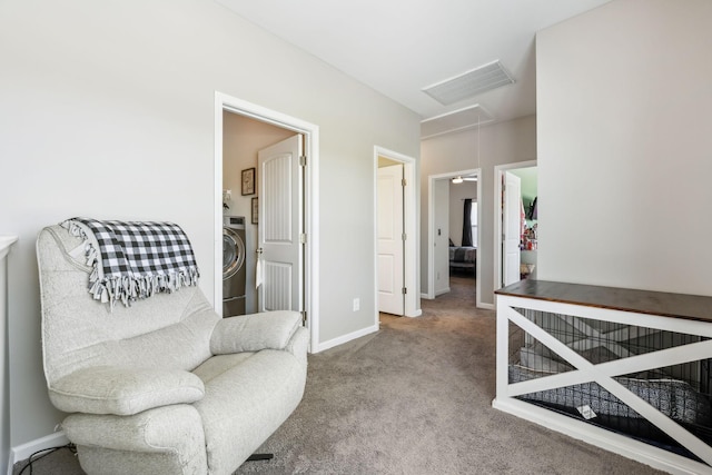 319 Petunia Dr, Smyrna, TN 37167 - living area with attic access, washer / dryer, carpet floors, and baseboards