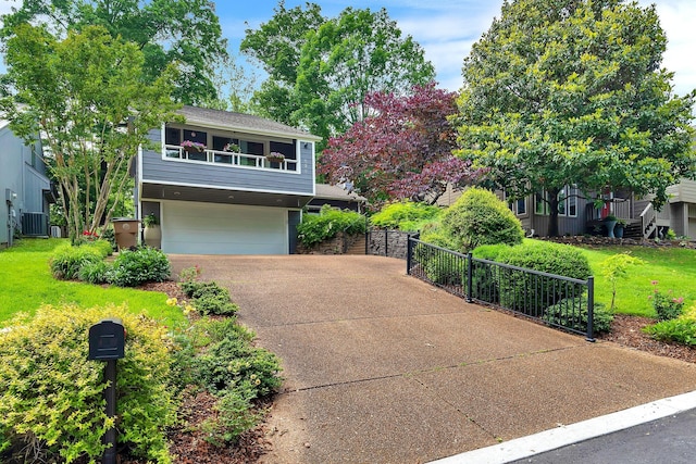 620 Harpeth Trace Dr, Nashville, TN 37221 - view of front of home with driveway, an attached garage, a gate, and central AC