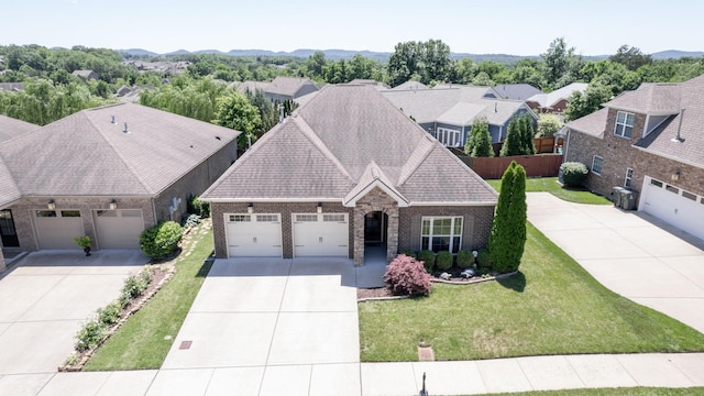 4421 Janefield Way, Nolensville, TN 37135 - view of front of property with concrete driveway, an attached garage, brick siding, and a front lawn