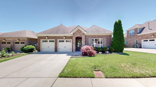 4421 Janefield Way, Nolensville, TN 37135 - view of front of house with driveway, a front yard, brick siding, and a garage