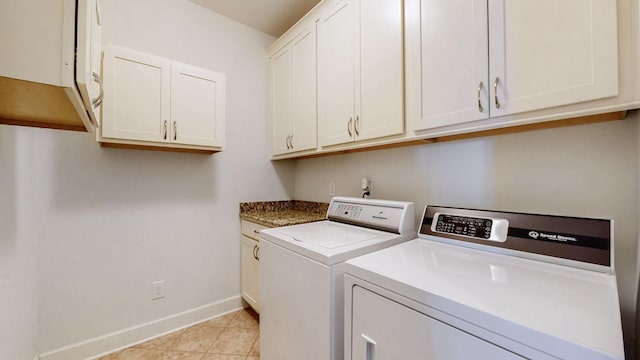 4421 Janefield Way, Nolensville, TN 37135 - laundry area with washing machine and clothes dryer, baseboards, cabinet space, and light tile patterned flooring