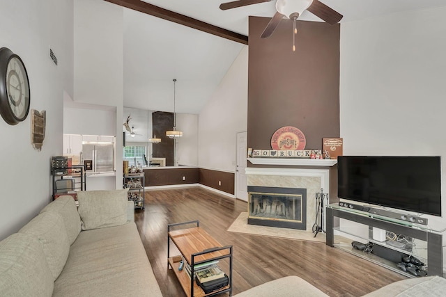 212 Post Creek Rd, Nashville, TN 37221 - living area featuring ceiling fan, wood finished floors, high vaulted ceiling, a tiled fireplace, and beamed ceiling