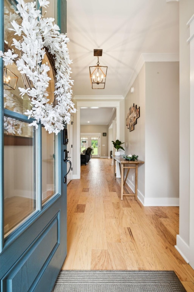 11769 Milton St, Milton, TN 37118 - entryway with crown molding, wood finished floors, a chandelier, and baseboards