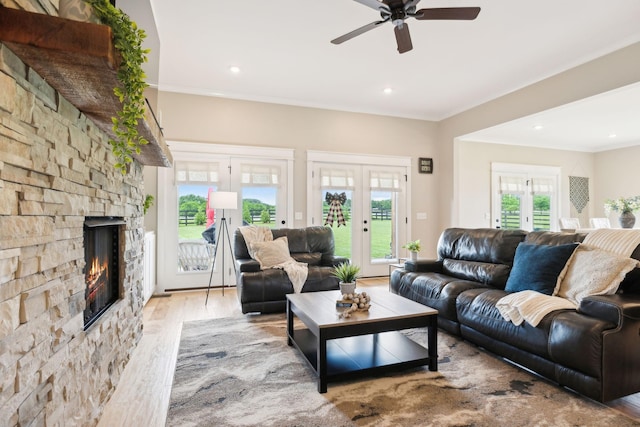 11769 Milton St, Milton, TN 37118 - living area featuring french doors, ceiling fan, wood finished floors, a stone fireplace, and recessed lighting