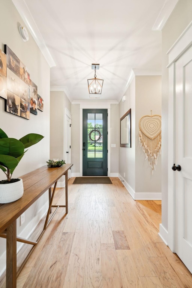 11769 Milton St, Milton, TN 37118 - foyer entrance with a chandelier, light wood-style floors, ornamental molding, and baseboards