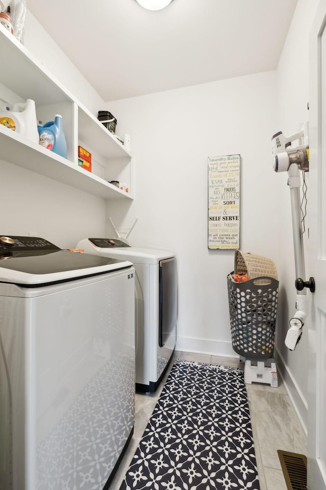 11769 Milton St, Milton, TN 37118 - washroom with independent washer and dryer, baseboards, and light tile patterned floors