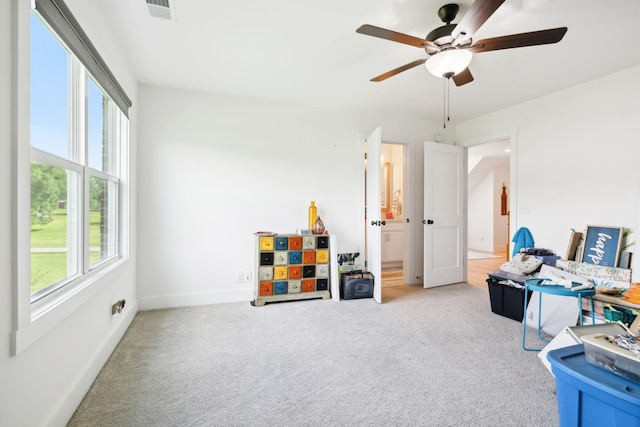 11769 Milton St, Milton, TN 37118 - playroom featuring a ceiling fan, light carpet, and baseboards