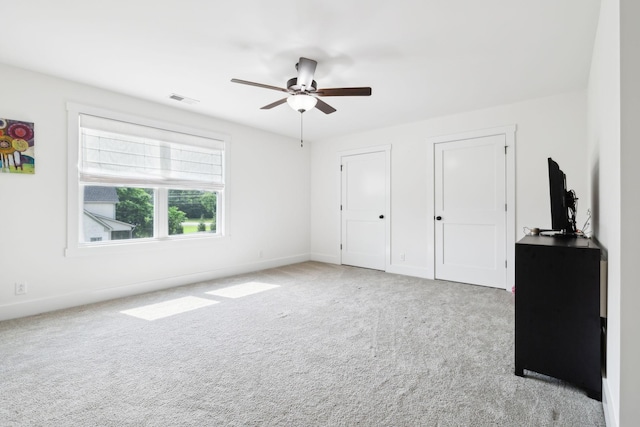 11769 Milton St, Milton, TN 37118 - unfurnished bedroom featuring carpet flooring, baseboards, two closets, and ceiling fan