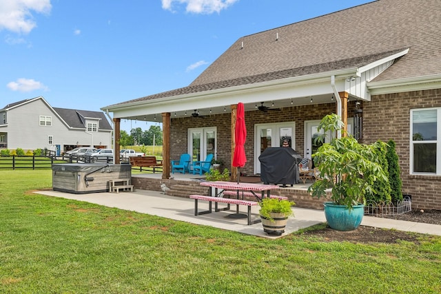 11769 Milton St, Milton, TN 37118 - rear view of house featuring a ceiling fan, brick siding, a patio area, and a shingled roof