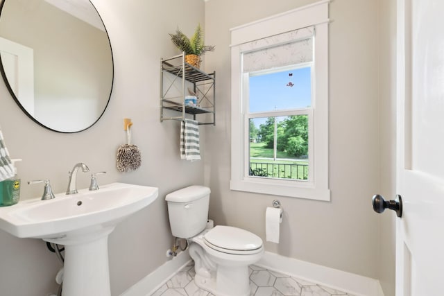 11769 Milton St, Milton, TN 37118 - bathroom with baseboards, toilet, and a sink