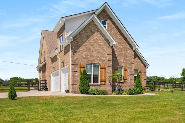 11769 Milton St, Milton, TN 37118 - view of side of property with concrete driveway, brick siding, a garage, and board and batten siding