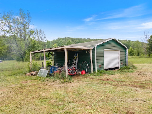 287 Rack Clayton Rd, Hohenwald, TN 38462 - garage featuring a view of trees