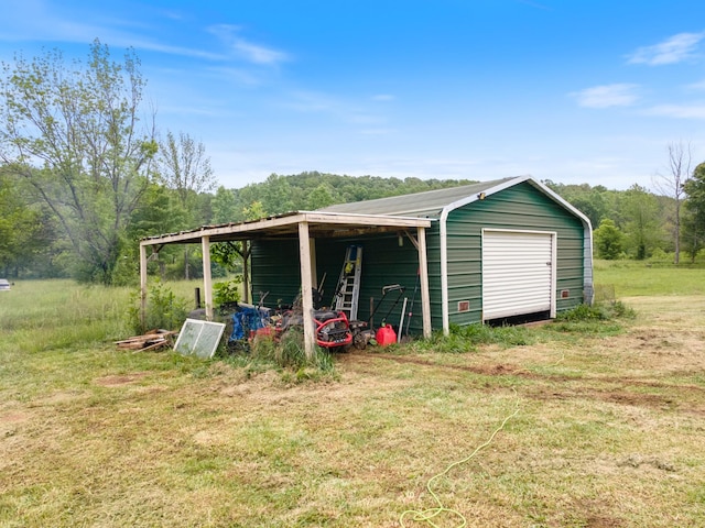 287 Rack Clayton Rd, Hohenwald, TN 38462 - garage with a forest view