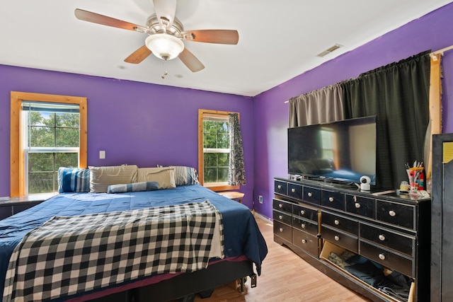287 Rack Clayton Rd, Hohenwald, TN 38462 - bedroom with multiple windows, wood finished floors, and ceiling fan