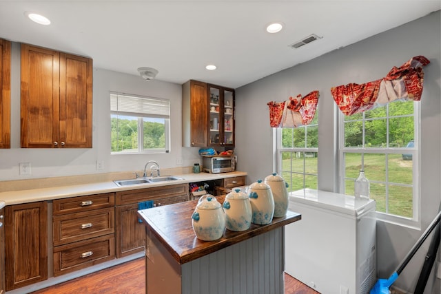 287 Rack Clayton Rd, Hohenwald, TN 38462 - kitchen featuring a sink, refrigerator, brown cabinetry, recessed lighting, and light wood finished floors