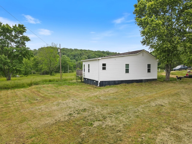 287 Rack Clayton Rd, Hohenwald, TN 38462 - view of side of home with a yard