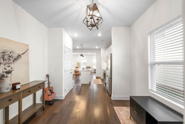 967 Nance Ln, Lebanon, TN 37087 - corridor featuring a chandelier, dark wood-style flooring, baseboards, a sink, and recessed lighting