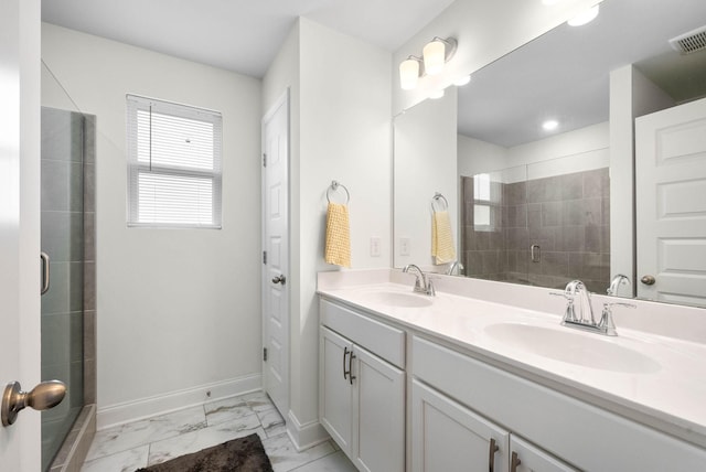 967 Nance Ln, Lebanon, TN 37087 - bathroom featuring a shower stall, marble look tile flooring, double vanity, and baseboards