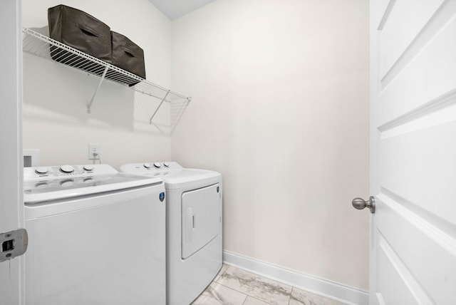 967 Nance Ln, Lebanon, TN 37087 - laundry area featuring washer and dryer, baseboards, and light marble finish floors