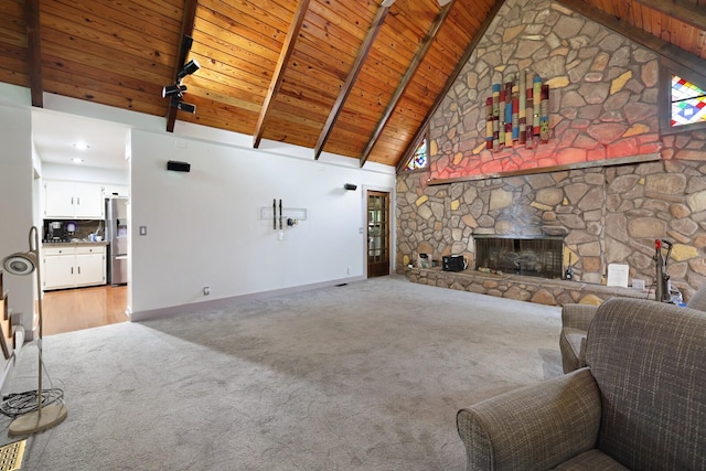 5904 S New Hope Rd, Hermitage, TN 37076 - living room with wood ceiling with exposed beams, light carpet, high vaulted ceiling, baseboards, and a stone fireplace