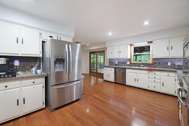 5904 S New Hope Rd, Hermitage, TN 37076 - kitchen featuring appliances with stainless steel finishes, tasteful backsplash, white cabinets, and recessed lighting
