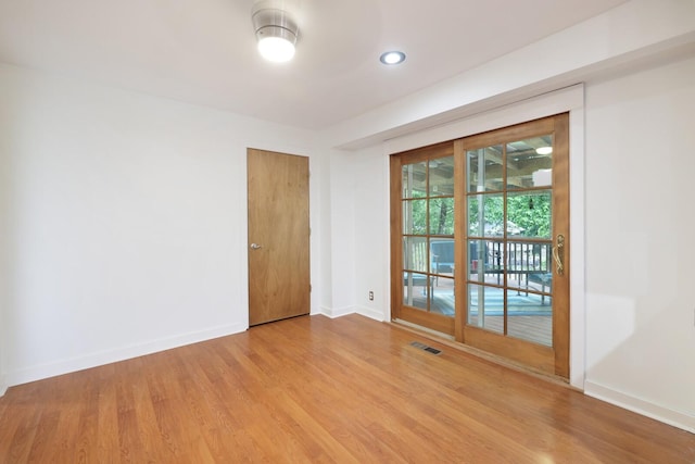 5904 S New Hope Rd, Hermitage, TN 37076 - unfurnished room featuring baseboards, wood finished floors, and recessed lighting