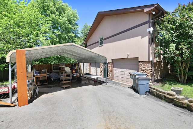 5904 S New Hope Rd, Hermitage, TN 37076 - view of front of home with stone siding, driveway, a detached carport, and a garage