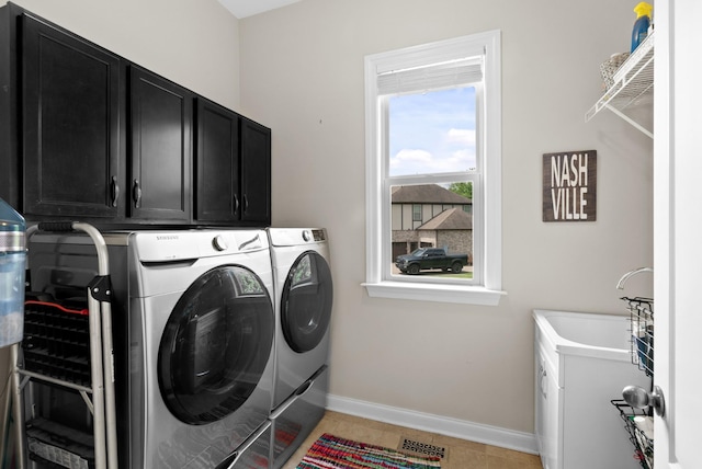 410 Pastoral Way, Nolensville, TN 37135 - washroom with washer and dryer, cabinet space, baseboards, and light tile patterned flooring