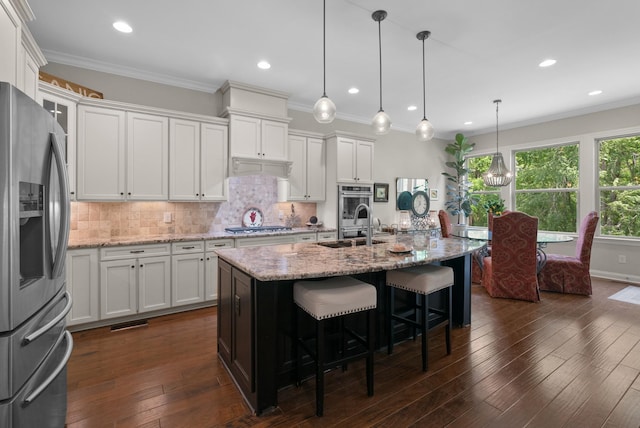 410 Pastoral Way, Nolensville, TN 37135 - kitchen featuring appliances with stainless steel finishes, white cabinetry, backsplash, dark wood-style flooring, and ornamental molding
