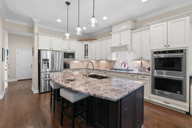 410 Pastoral Way, Nolensville, TN 37135 - kitchen featuring a sink, appliances with stainless steel finishes, a breakfast bar, light stone countertops, and recessed lighting