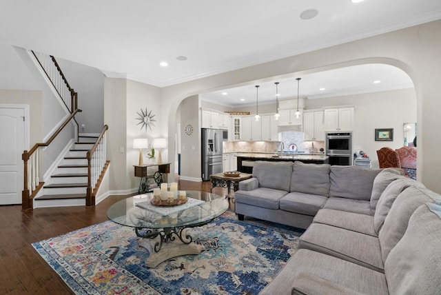 410 Pastoral Way, Nolensville, TN 37135 - living room with arched walkways, dark wood-type flooring, stairway, baseboards, and recessed lighting