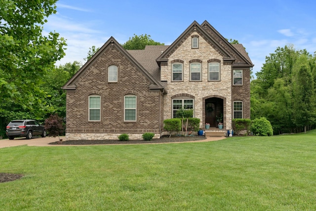 410 Pastoral Way, Nolensville, TN 37135 - french provincial home featuring a front lawn, brick siding, and stone siding