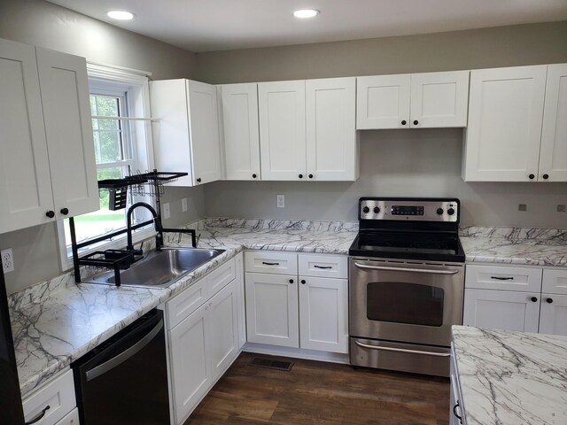 910 Hassell Dr, Waynesboro, TN 38485 - kitchen with stainless steel electric stove, dishwashing machine, a sink, white cabinetry, and recessed lighting