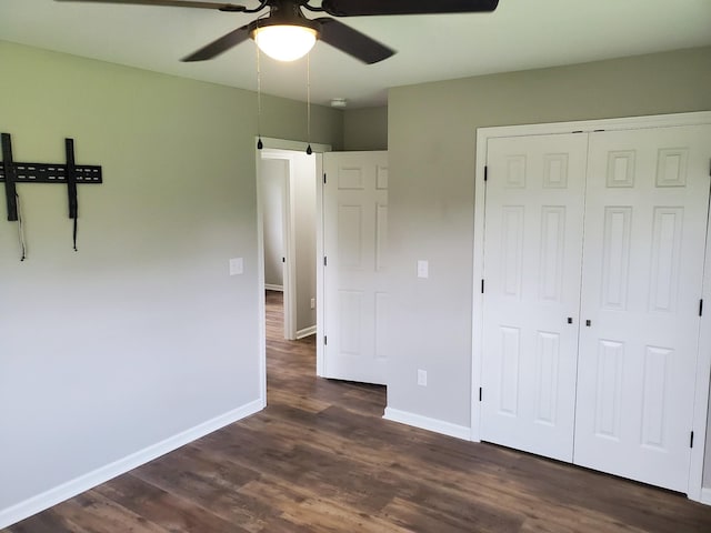 910 Hassell Dr, Waynesboro, TN 38485 - unfurnished bedroom with dark wood-style flooring, a closet, baseboards, and a ceiling fan