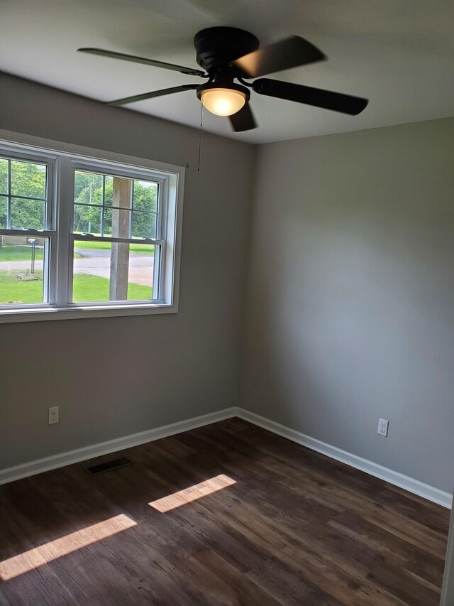 910 Hassell Dr, Waynesboro, TN 38485 - unfurnished room with dark wood finished floors, ceiling fan, and baseboards